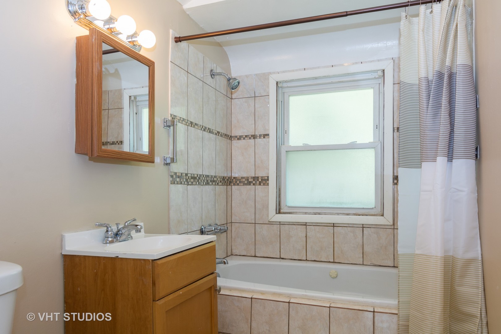 2510 East 96th Street Chicago, IL 60617 - Photo 10 of 13 a bathroom with a sink toilet vanity and tub