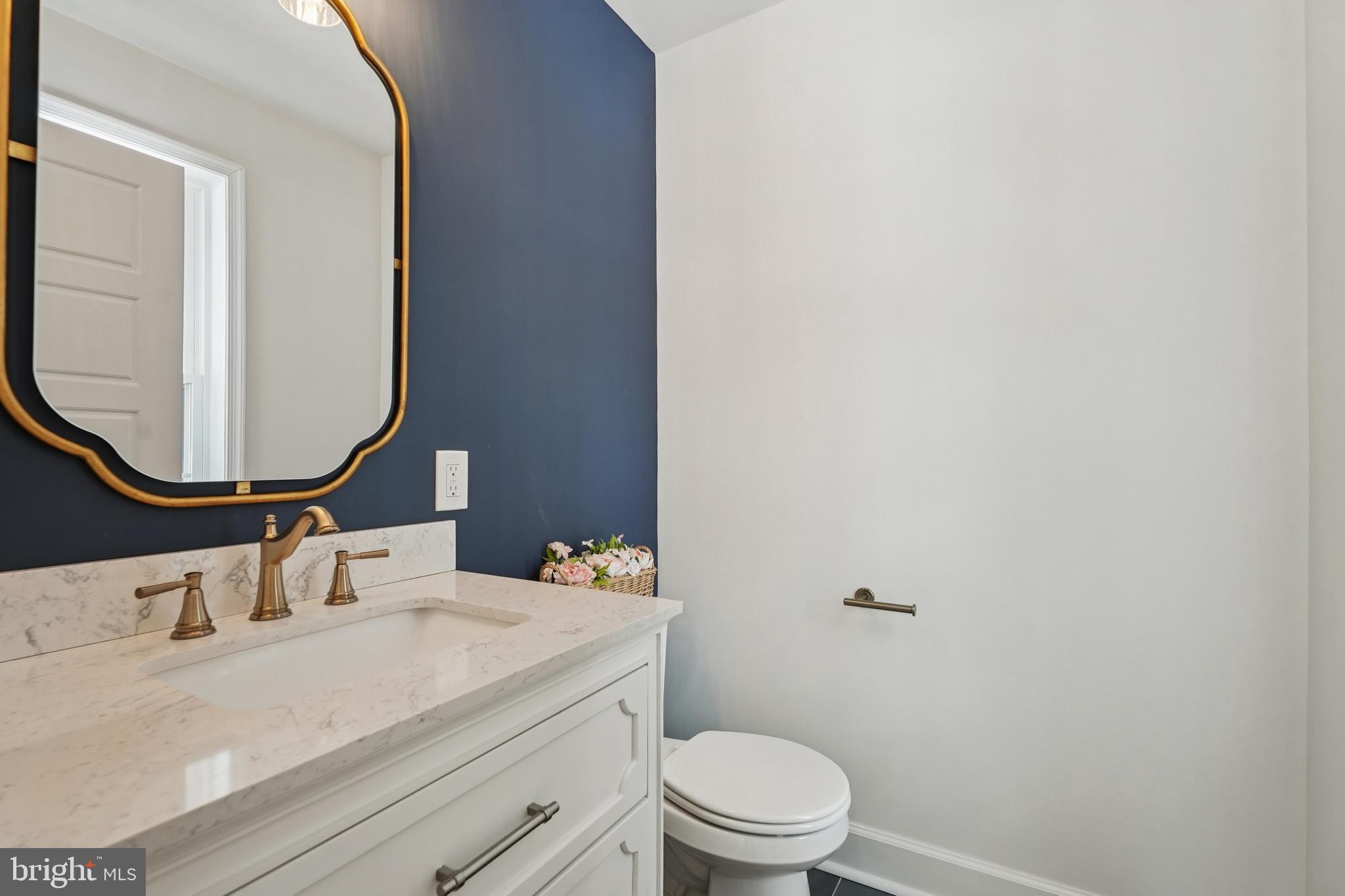 750 Maple Avenue Southampton, NJ 08088 - Photo 17 of 52 a bathroom with a granite countertop sink mirror vanity and toilet