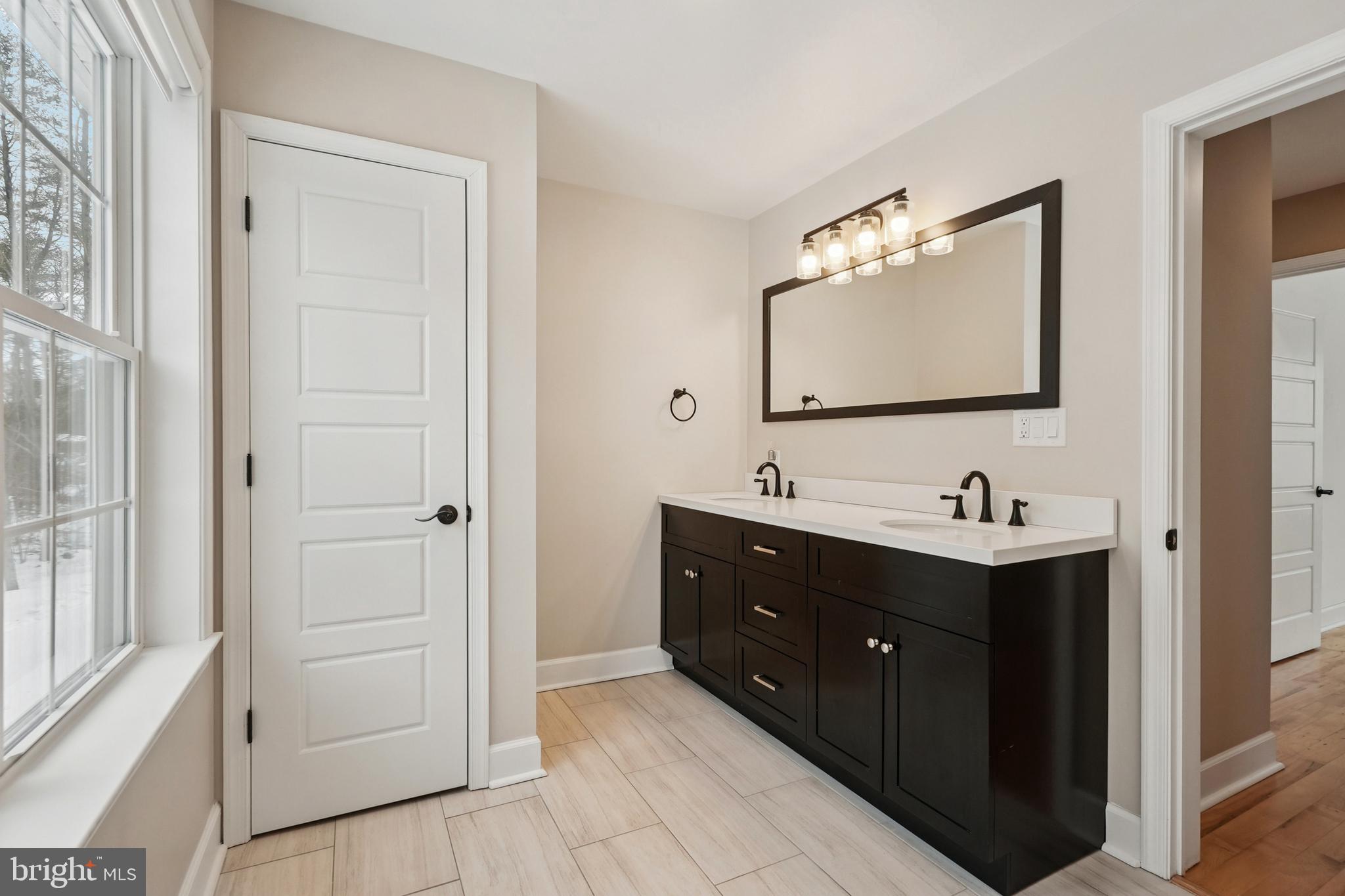750 Maple Avenue Southampton, NJ 08088 - Photo 27 of 52 a bathroom with a sink vanity and mirror