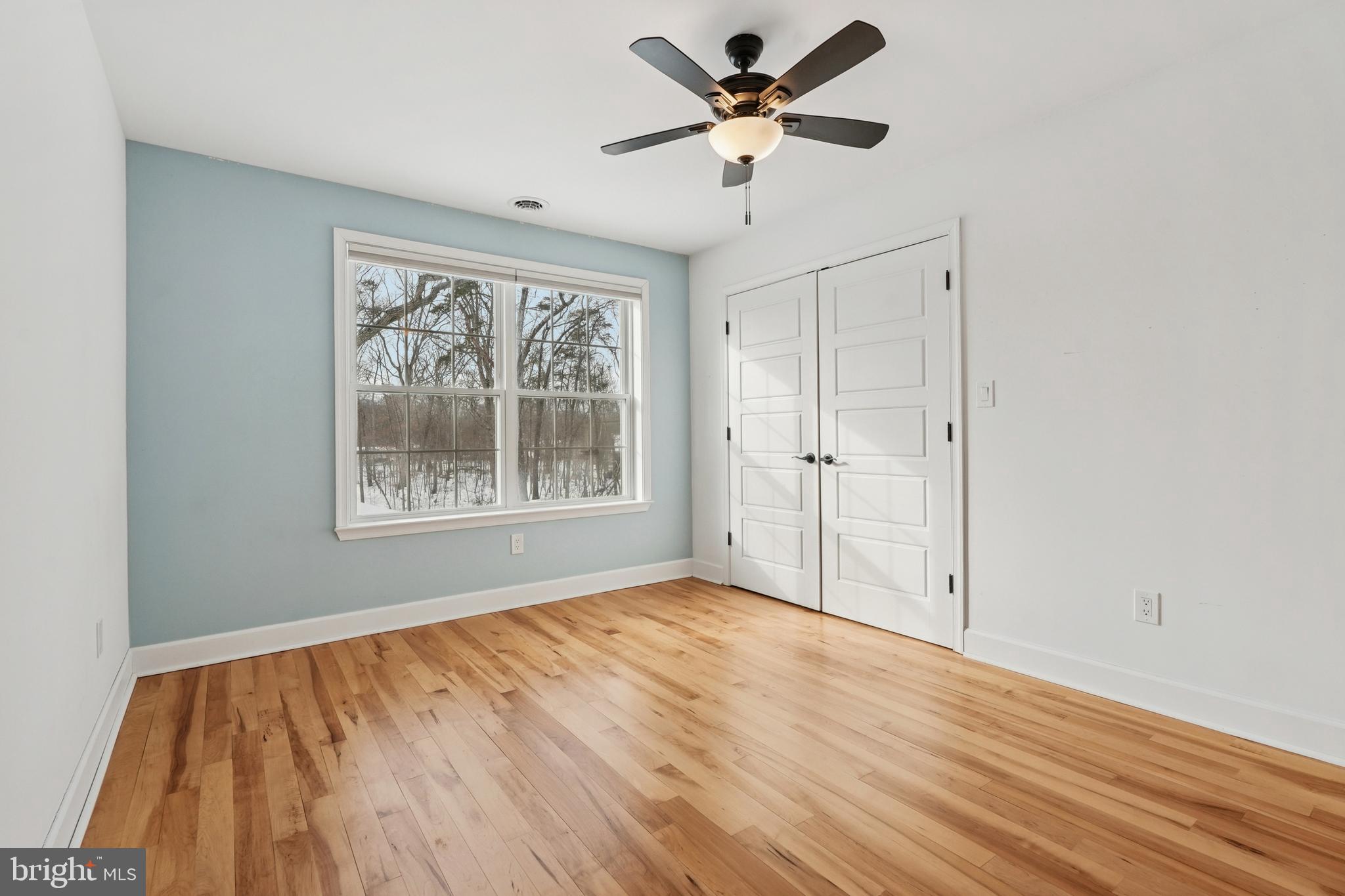 750 Maple Avenue Southampton, NJ 08088 - Photo 31 of 52 a view of an empty room with a window and a ceiling fan