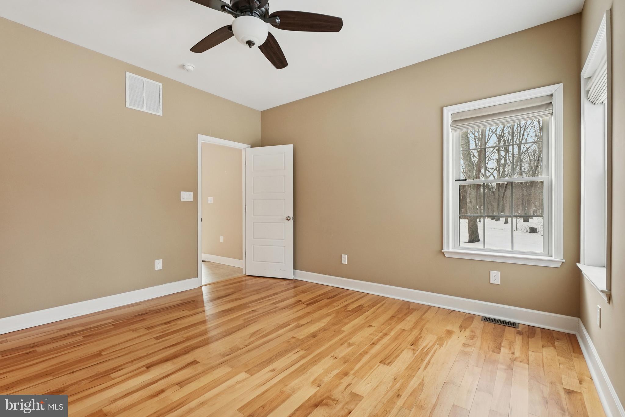 750 Maple Avenue Southampton, NJ 08088 - Photo 33 of 52 a view of an empty room with wooden floor and a window