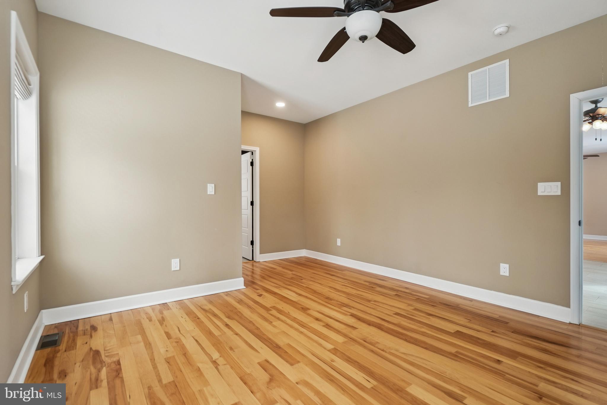 750 Maple Avenue Southampton, NJ 08088 - Photo 34 of 52 a view of room with a ceiling fan and wooden floor