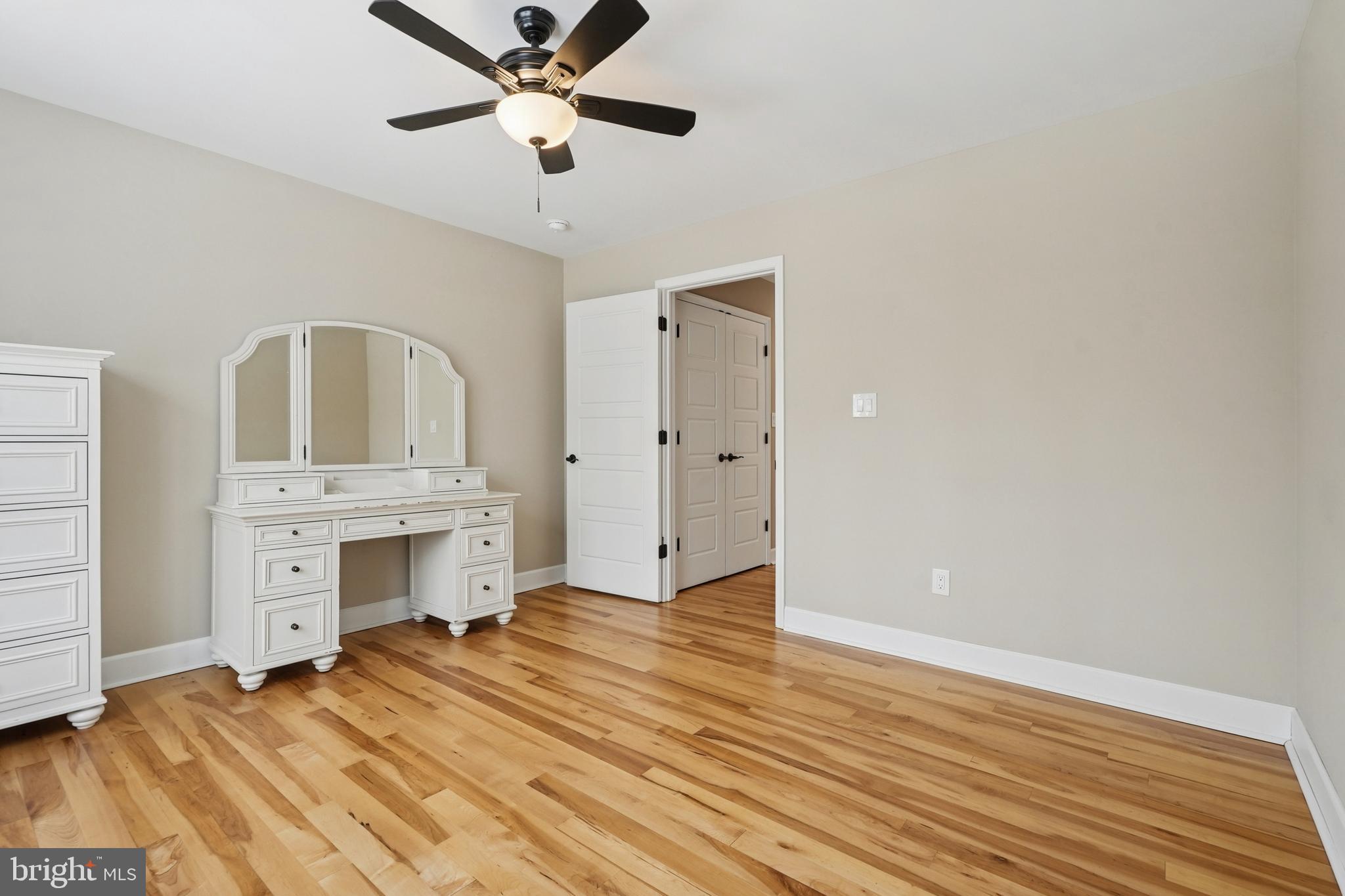 750 Maple Avenue Southampton, NJ 08088 - Photo 36 of 52 an empty room with a fireplace and wooden floor