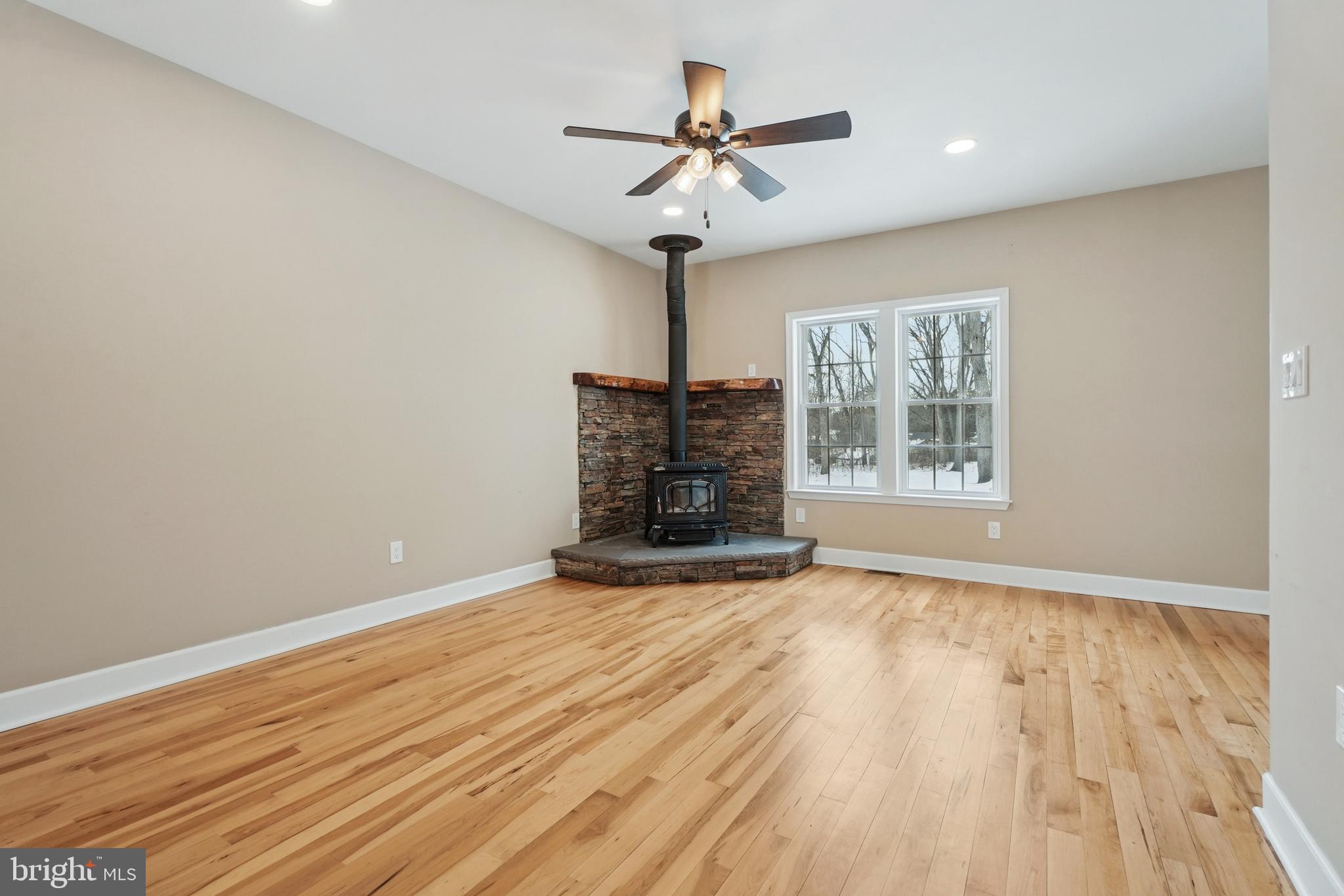 750 Maple Avenue Southampton, NJ 08088 - Photo 5 of 52 a view of an empty room with wooden floor and a window