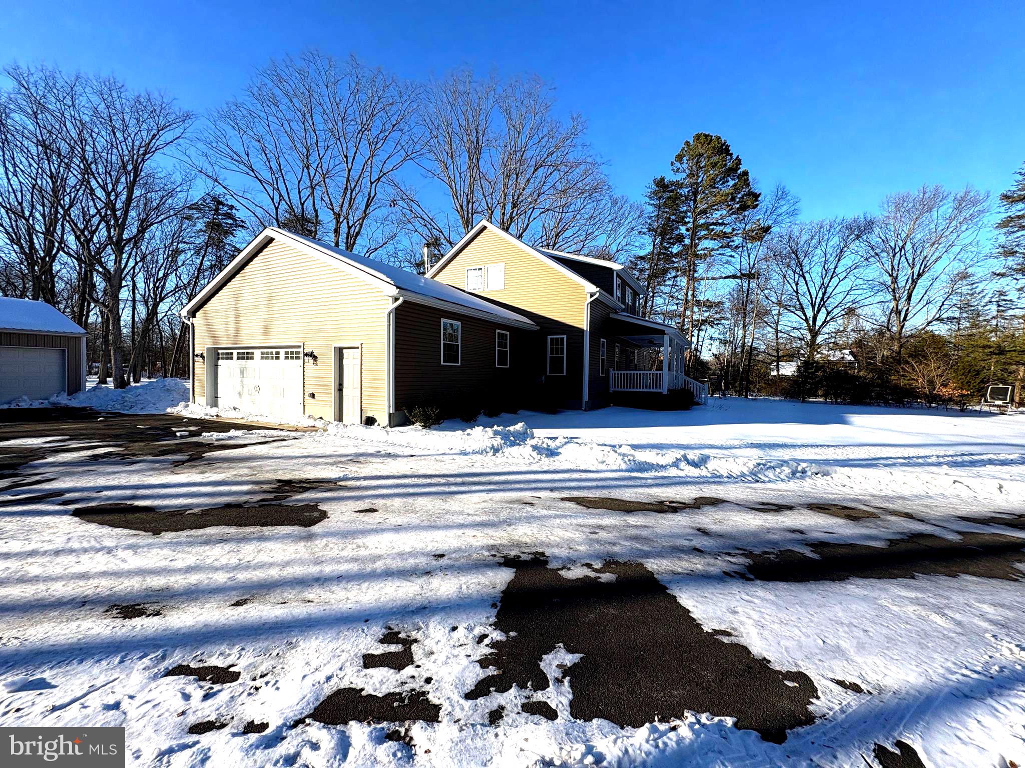 750 Maple Avenue Southampton, NJ 08088 - Photo 5 of 6 a view of a house with a backyard and a fireplace