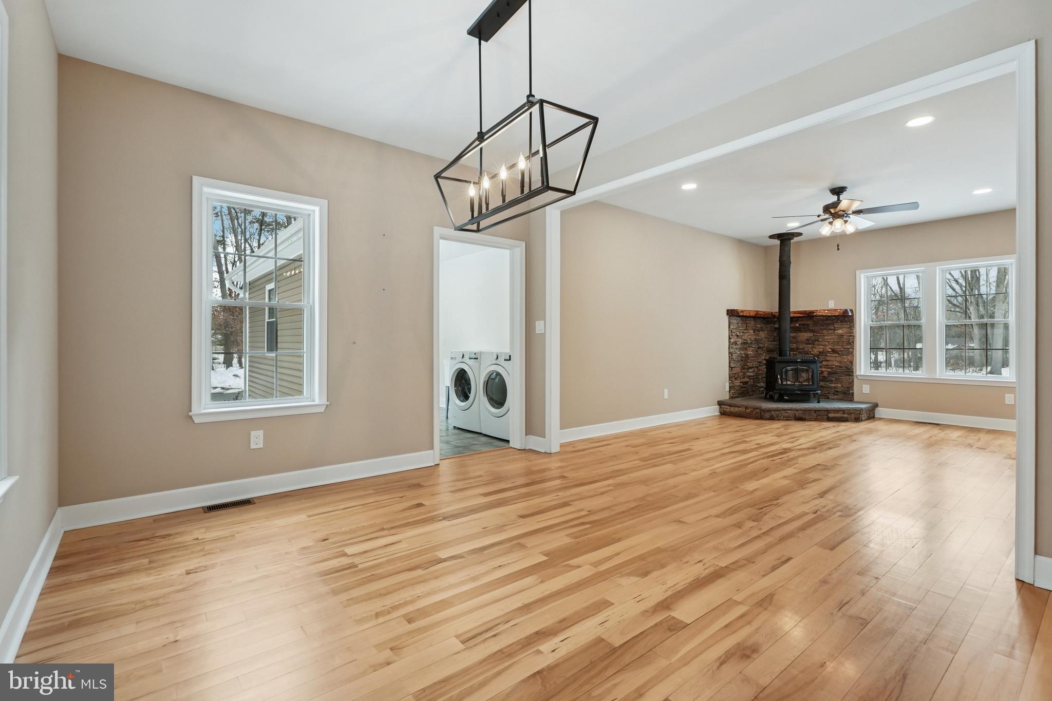 750 Maple Avenue Southampton, NJ 08088 - Photo 8 of 52 a view of an empty room with a window and wooden floor