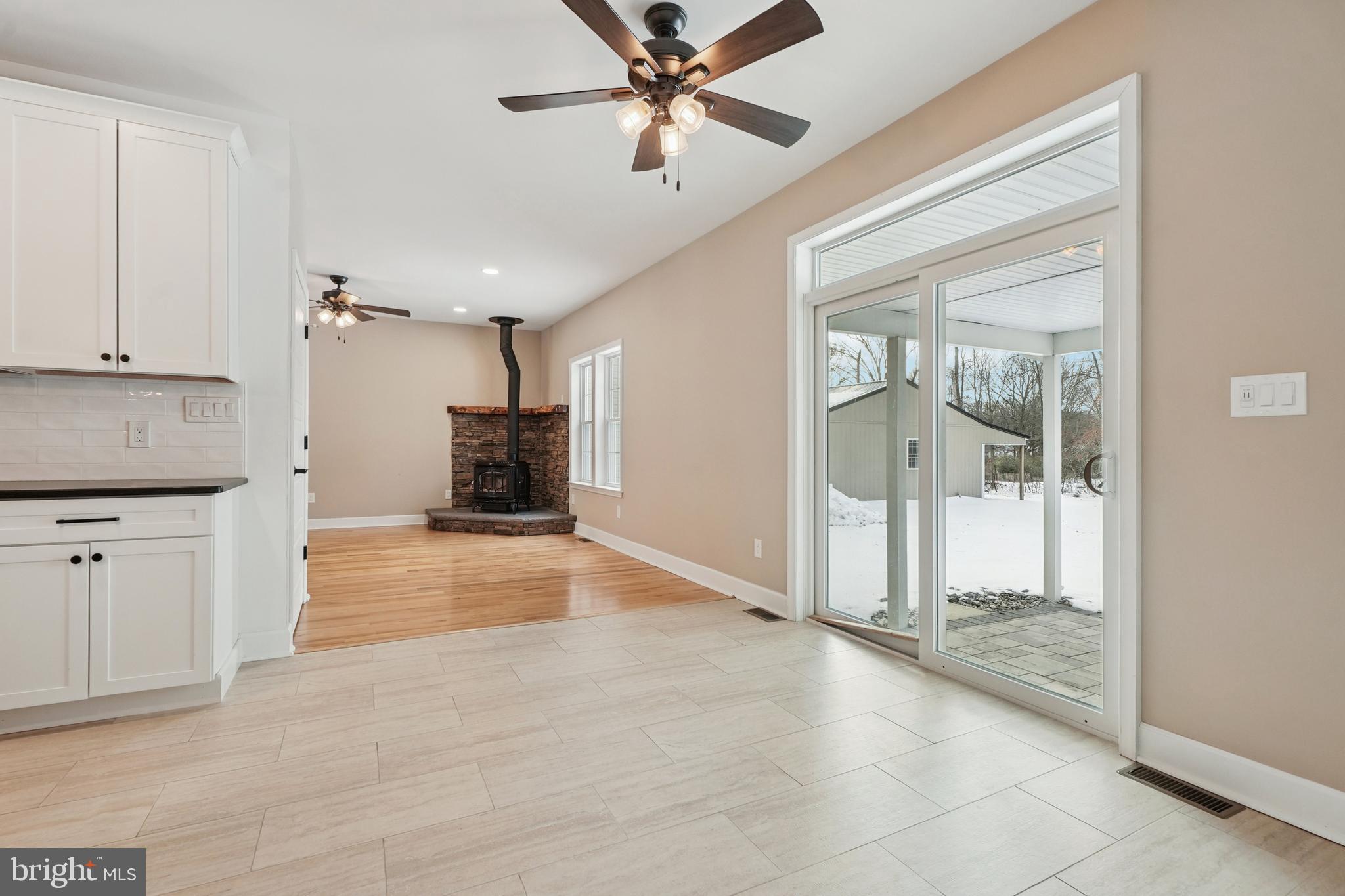 750 Maple Avenue Southampton, NJ 08088 - Photo 9 of 52 a view of a livingroom with a chandelier fan and kitchen view