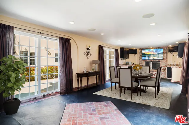 a living room with fireplace furniture and a flat screen tv