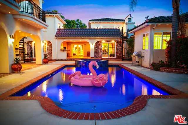 a view of a swimming pool with sitting space