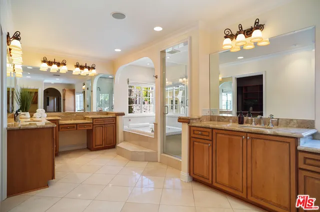 a view of a swimming pool with sitting space