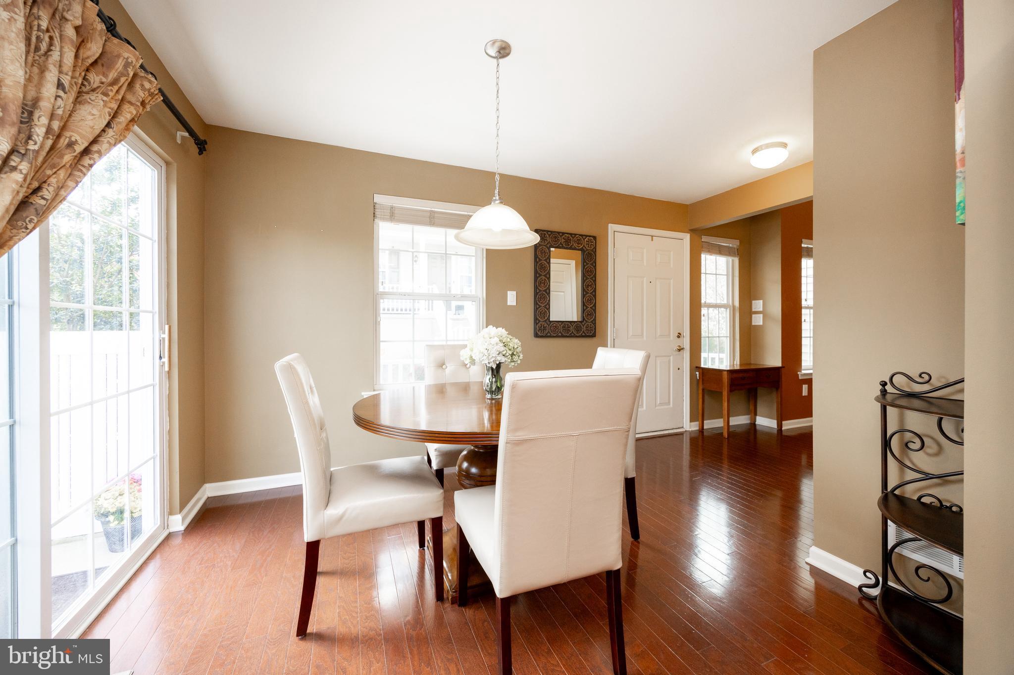 19 Granite Lane, Unit 4 Chester Springs, PA 19425 - Photo 19 of 45 a view of a dining room with furniture window and wooden floor