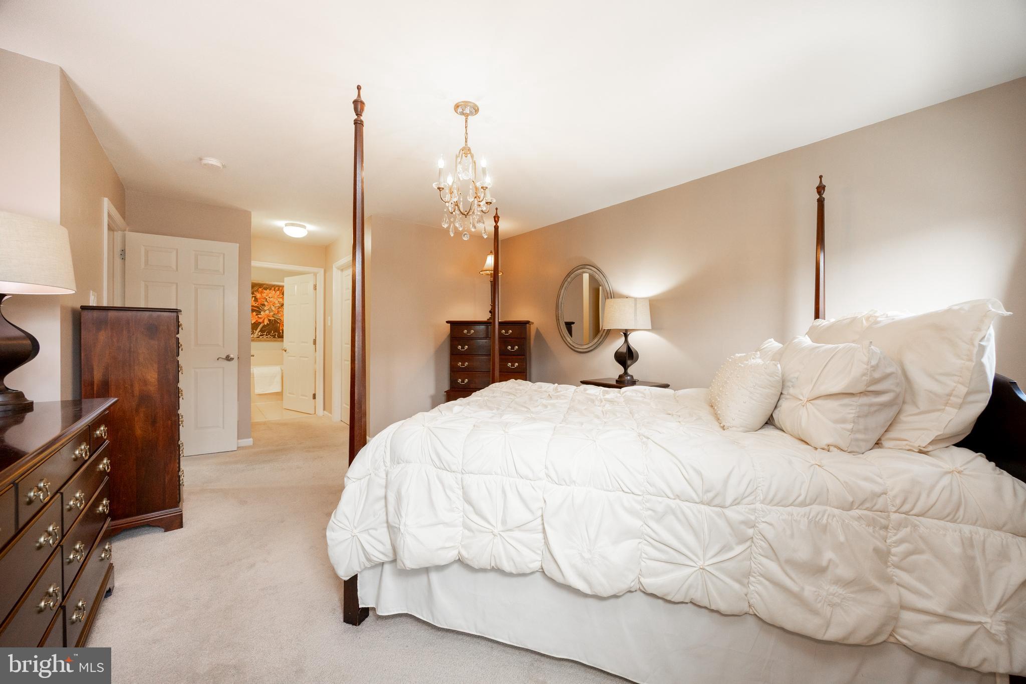 19 Granite Lane, Unit 4 Chester Springs, PA 19425 - Photo 22 of 45 a large white bed in a white room