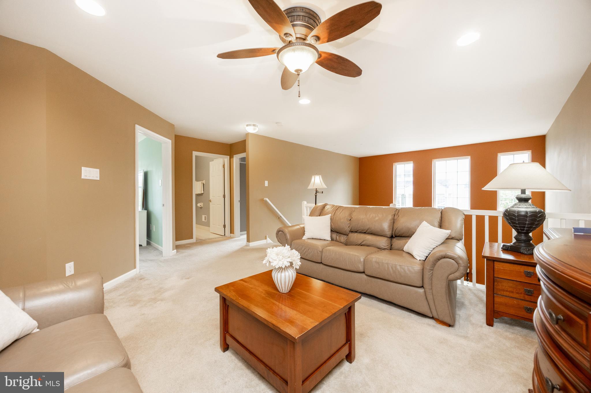 19 Granite Lane, Unit 4 Chester Springs, PA 19425 - Photo 27 of 45 a living room with furniture and a ceiling fan
