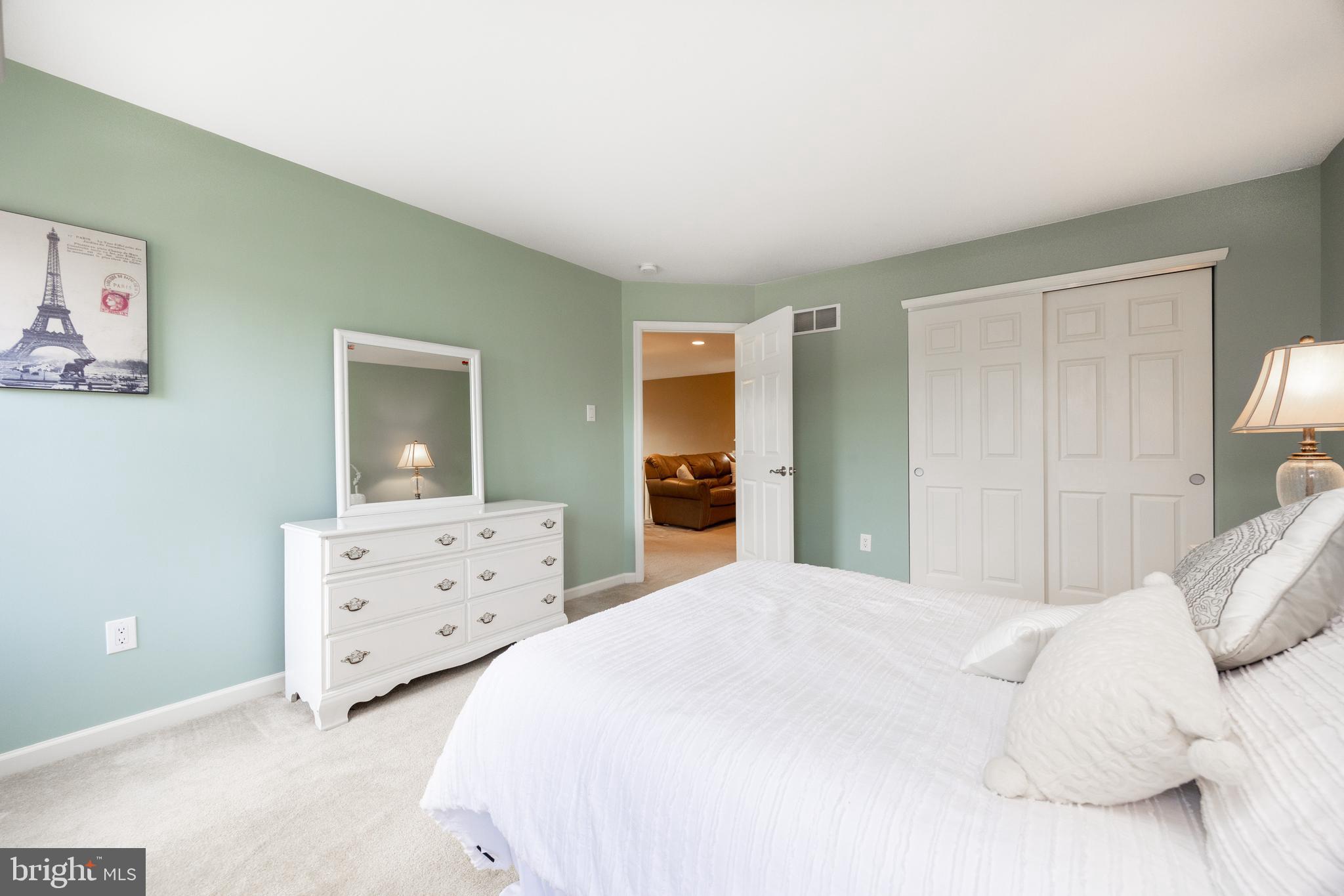 19 Granite Lane, Unit 4 Chester Springs, PA 19425 - Photo 29 of 45 a bedroom with a bed and a dresser
