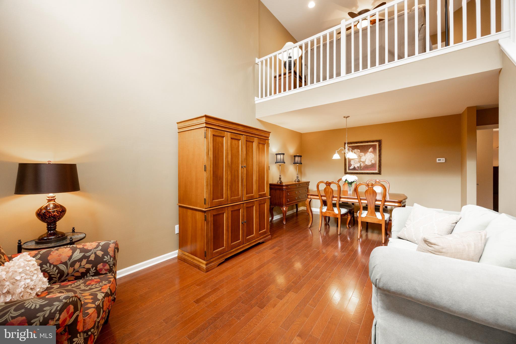 19 Granite Lane, Unit 4 Chester Springs, PA 19425 - Photo 9 of 45 a living room with furniture a dining table and a window