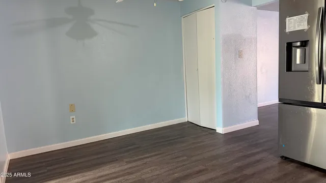 a view of a room with wooden floor