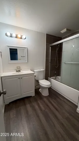 a bathroom with a sink a toilet and a bathtub