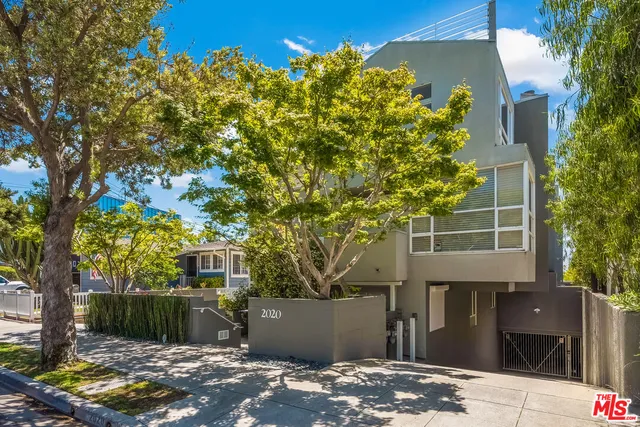front view of a house with a tree