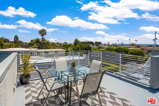 a view of a chairs and table on the terrace