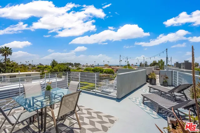 a view of a terrace with furniture