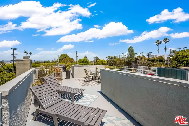 a view of roof deck with patio