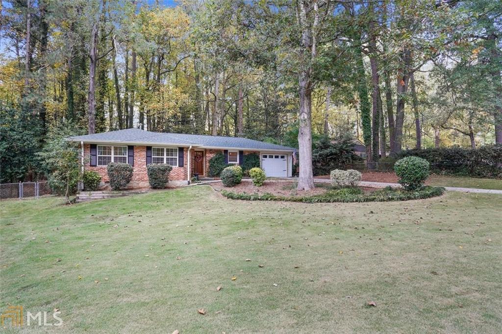 1651 Tryon Road Northeast Atlanta, GA 30341 - Photo 1 of 1 a view of house with outdoor space and swimming pool