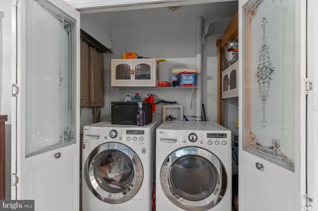 a view of a dining room with furniture and a chandelier