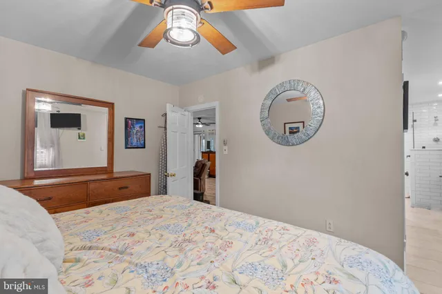 a spacious bathroom with a double vanity sink a mirror and a bathtub