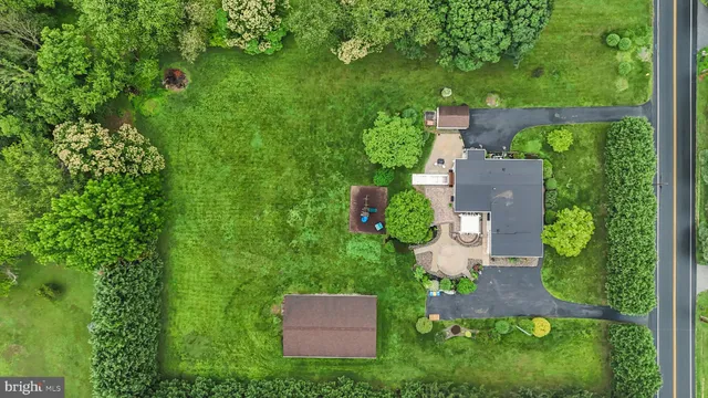 an aerial view of a house with yard