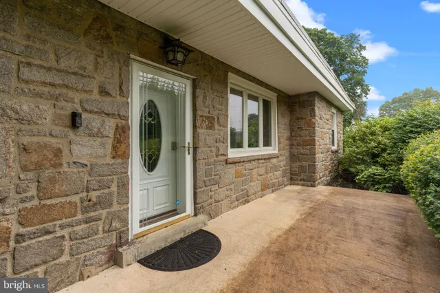 a view of a brick house with a large windows