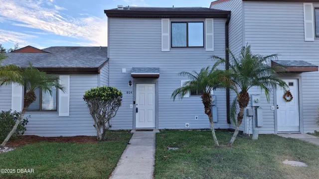 a view of a refrigerator in kitchen and wooden floor