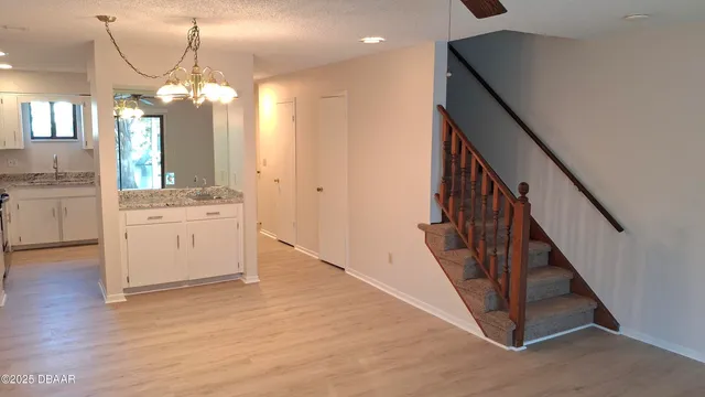 a view of a kitchen cabinets and wooden floor