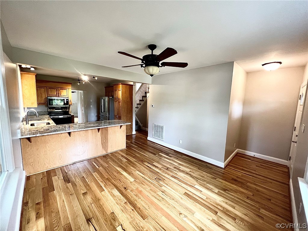 4600 Centralia Road Chester, VA 23831 - Photo 4 of 32 Kitchen with light parquet floors, stainless steel appliances, and ceiling fan