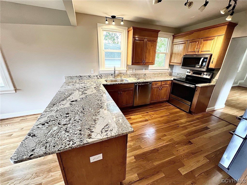4600 Centralia Road Chester, VA 23831 - Photo 8 of 32 Kitchen with stainless steel appliances, rail lighting, light parquet floors, and light granite-like countertops