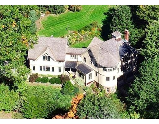 an aerial view of a house with garden space and street view