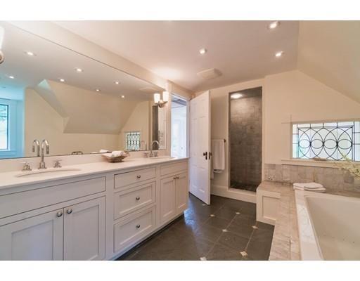 204 Nashawtuc Road Concord, MA 01742 - Photo 17 of 30 a spacious bathroom with a granite countertop sink a mirror and a shower
