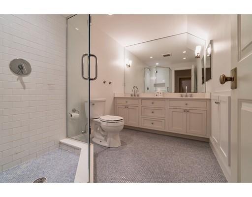 204 Nashawtuc Road Concord, MA 01742 - Photo 22 of 30 a bathroom with a toilet a sink a mirror and shower