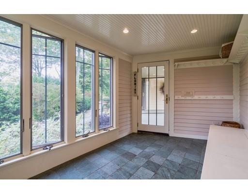204 Nashawtuc Road Concord, MA 01742 - Photo 24 of 30 a view of empty room with wooden floor and fan