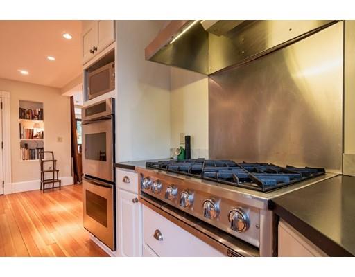 204 Nashawtuc Road Concord, MA 01742 - Photo 6 of 30 a kitchen with a stove and a refrigerator