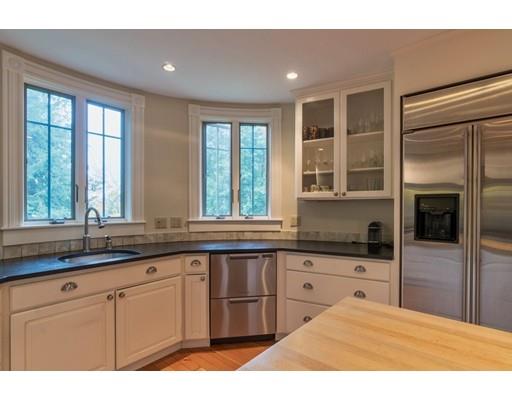 204 Nashawtuc Road Concord, MA 01742 - Photo 8 of 30 a kitchen with granite countertop a sink stainless steel appliances and cabinets