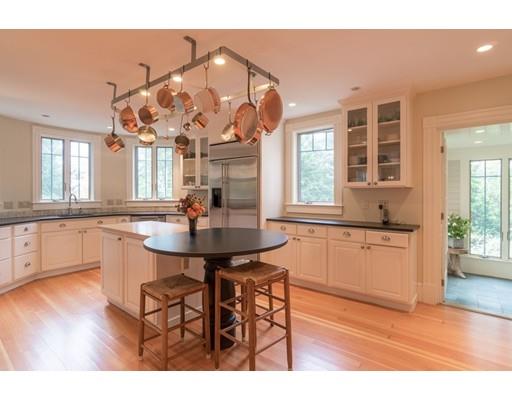 204 Nashawtuc Road Concord, MA 01742 - Photo 9 of 30 a kitchen with a sink cabinets and wooden floor