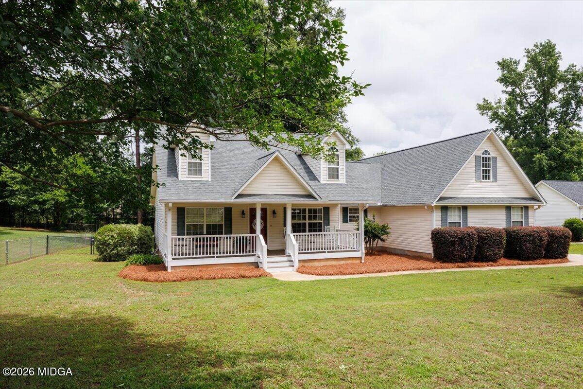 557 Aarons Circle Gray, GA 31032 - Photo 2 of 36 a front view of house with yard and green space