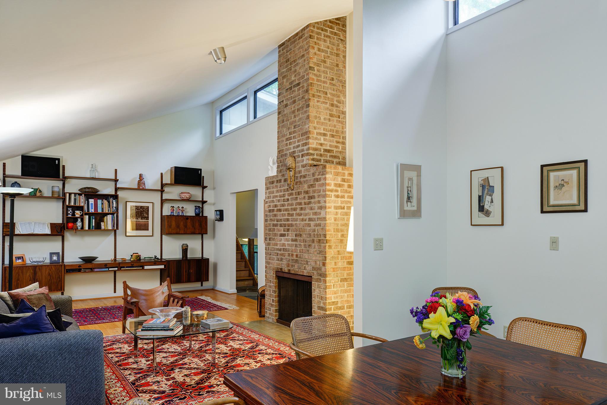 12010 Aintree Lane Reston, VA 20191 - Photo 3 of 28 Double Fireplace graces the Living R + Breakfast R