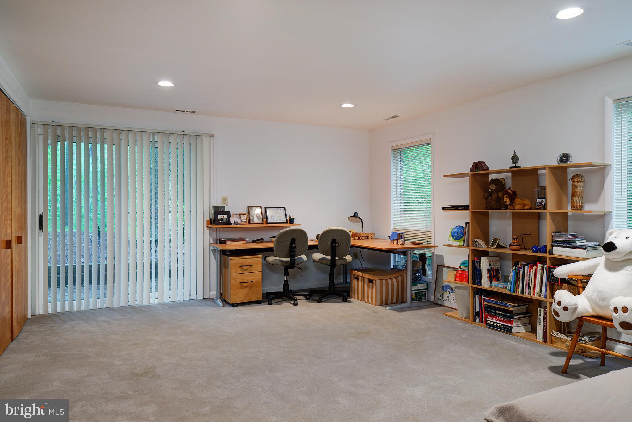 12010 Aintree Lane Reston, VA 20191 - Photo 23 of 28 Sliding doors lead to brick patio. Murphy bed!