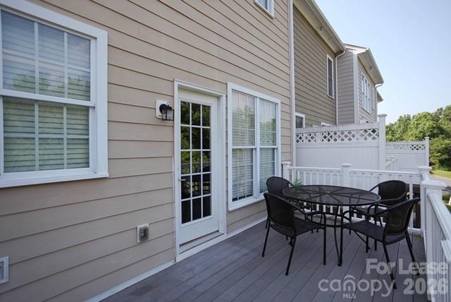 1098 Drayton Court Fort Mill, SC 29708 - Photo 14 of 16 a view of a deck with table and chairs and wooden floor