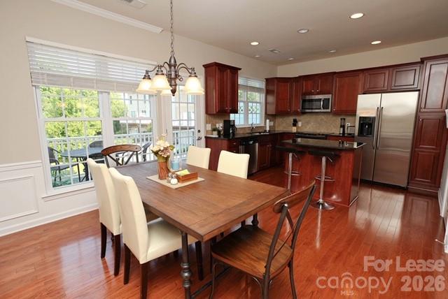 1098 Drayton Court Fort Mill, SC 29708 - Photo 6 of 16 a view of a dining room with furniture window and wooden floor