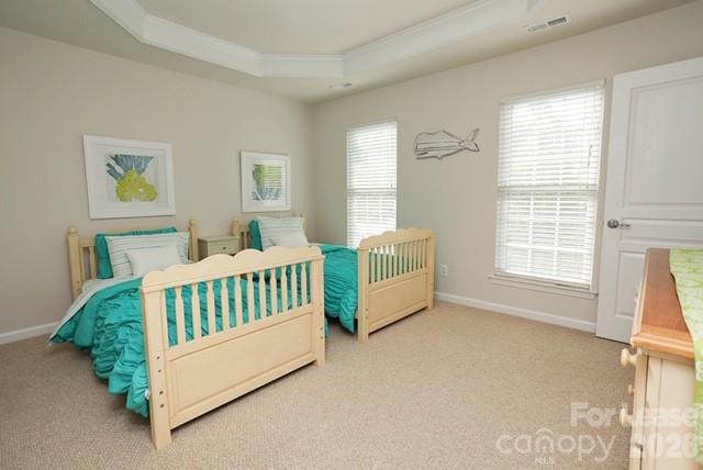 1098 Drayton Court Fort Mill, SC 29708 - Photo 8 of 16 a bed sitting in a bedroom next to a window