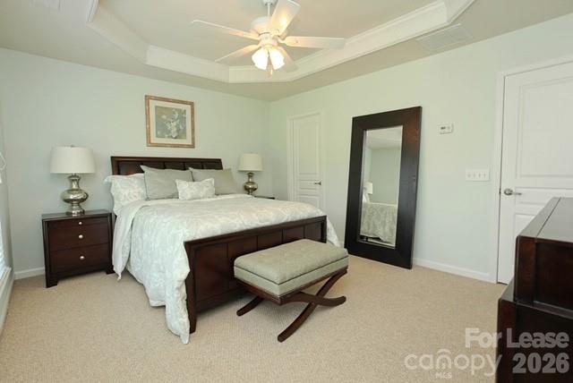 1098 Drayton Court Fort Mill, SC 29708 - Photo 10 of 16 a bedroom with a bed and a chandelier