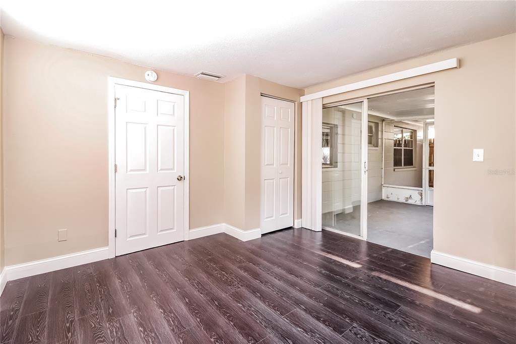 6230 Westport Drive Port Richey, FL 34668 - Photo 12 of 15 wooden floor in an empty room