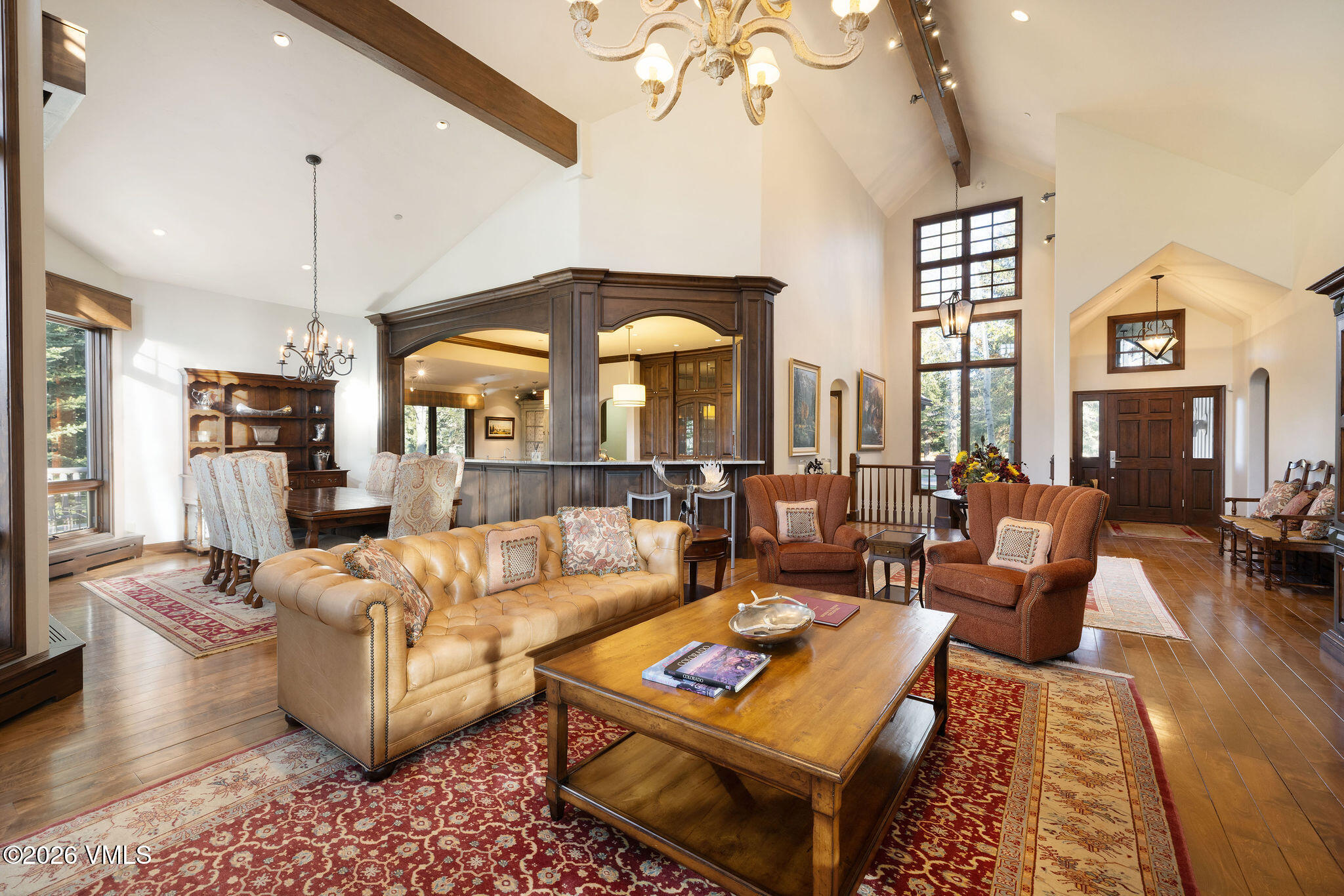 102 Saddle Ridge Loop Edwards, CO 81632 - Photo 4 of 29 a living room with furniture a chandelier and a large window